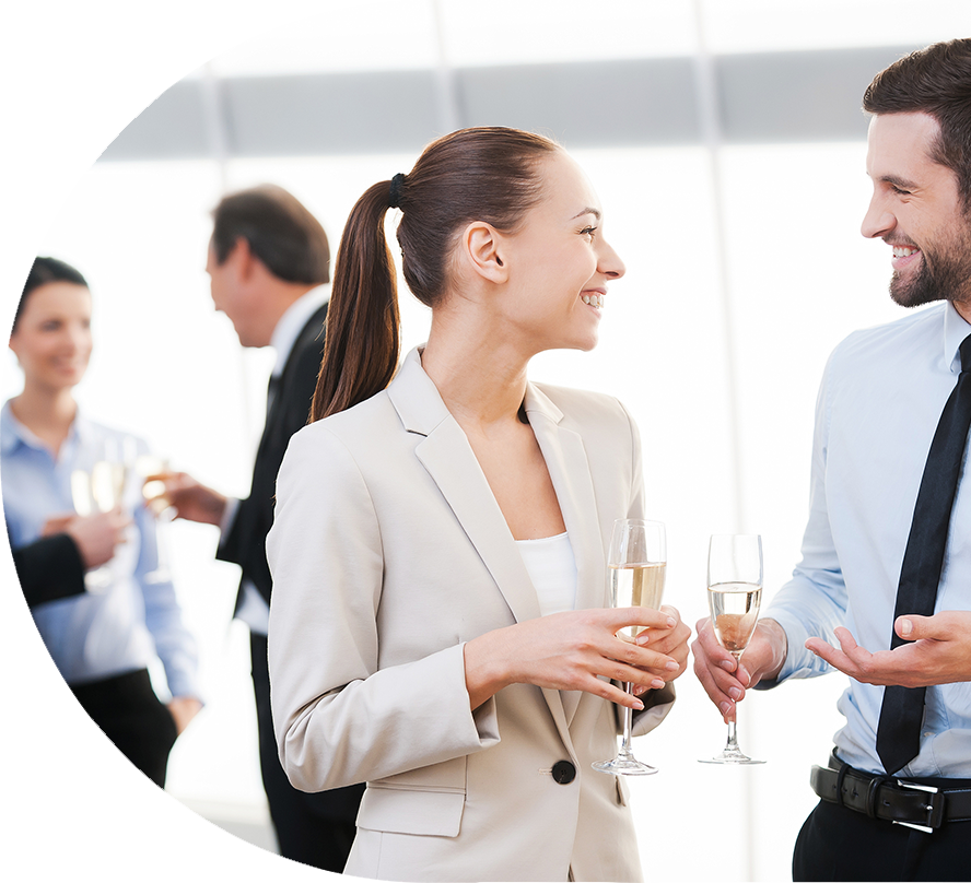 colleagues smiling while celebrating in office