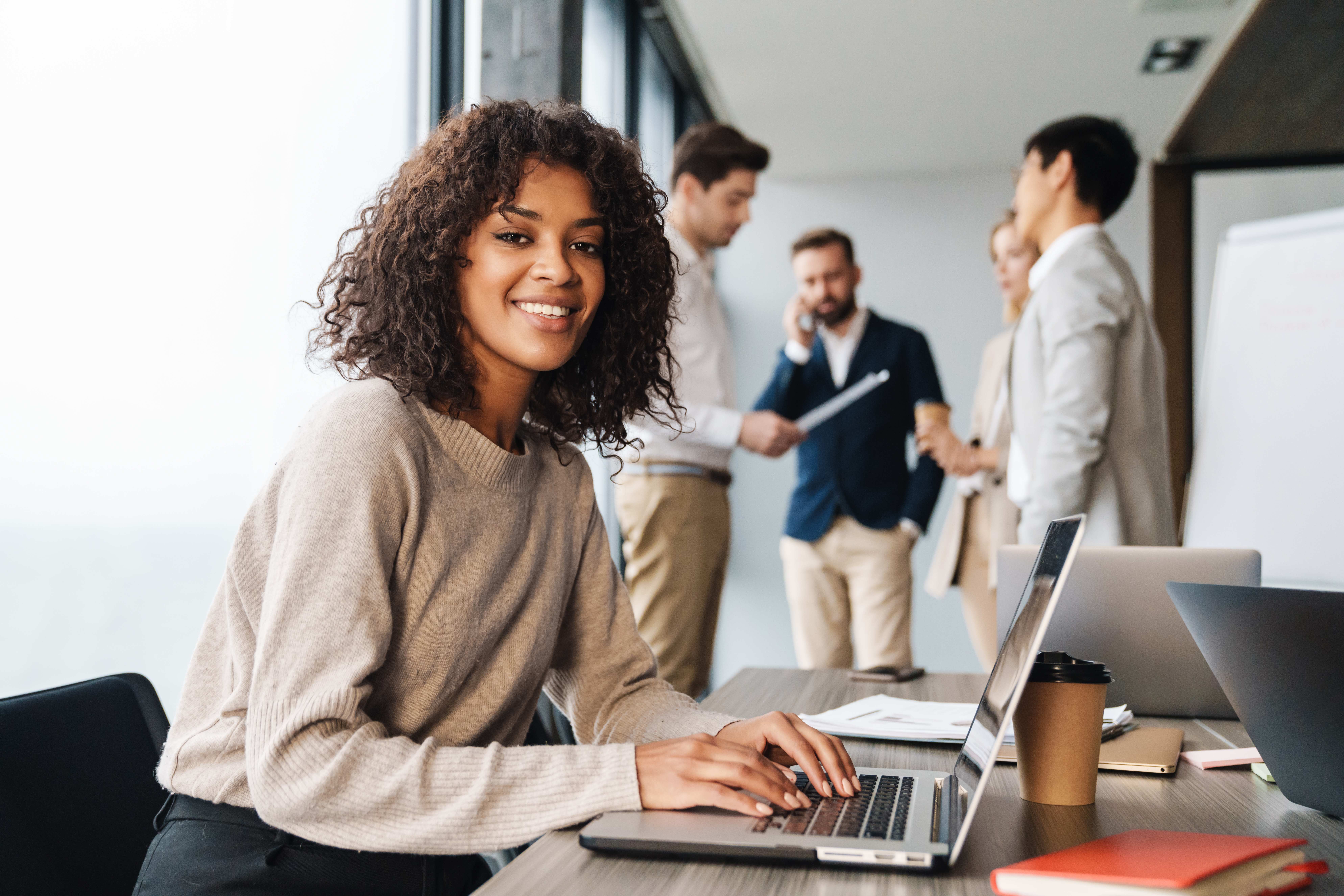 Attractive,African,Young,Confident,Businesswoman,Sitting,At,The,Office,Table Girl smiling