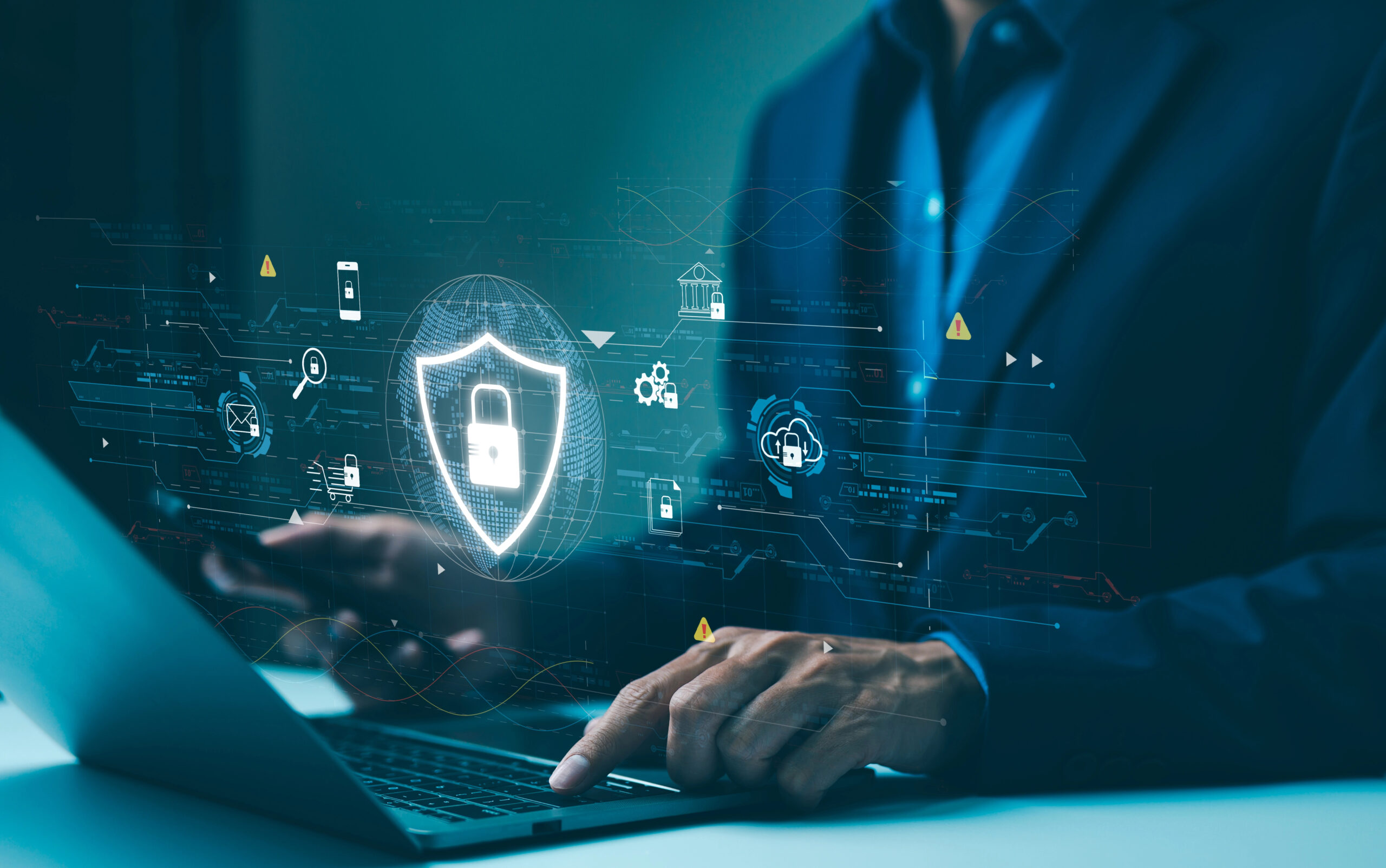 Professional managing cybersecurity protocols on laptop to protect sensitive business data 