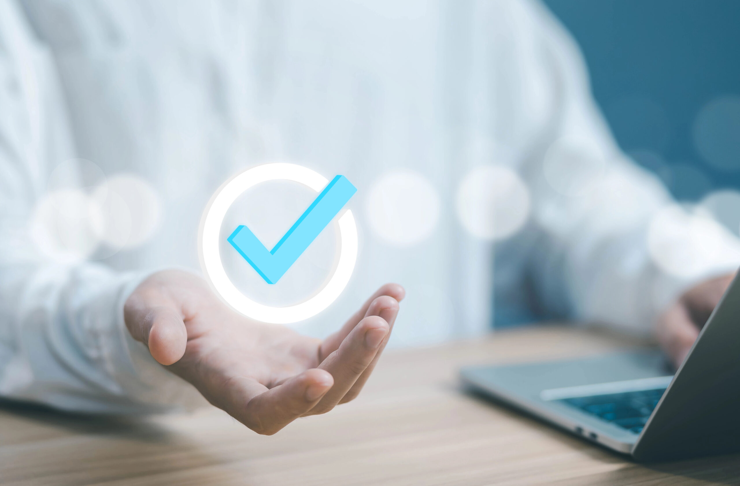 Businessman selecting digital checkbox symbolizing disaster recovery and business continuity testing, verification, and operational readiness in manufacturing.